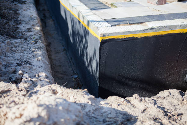 Professional Waterproofing technician working in Manahawkin, NJ